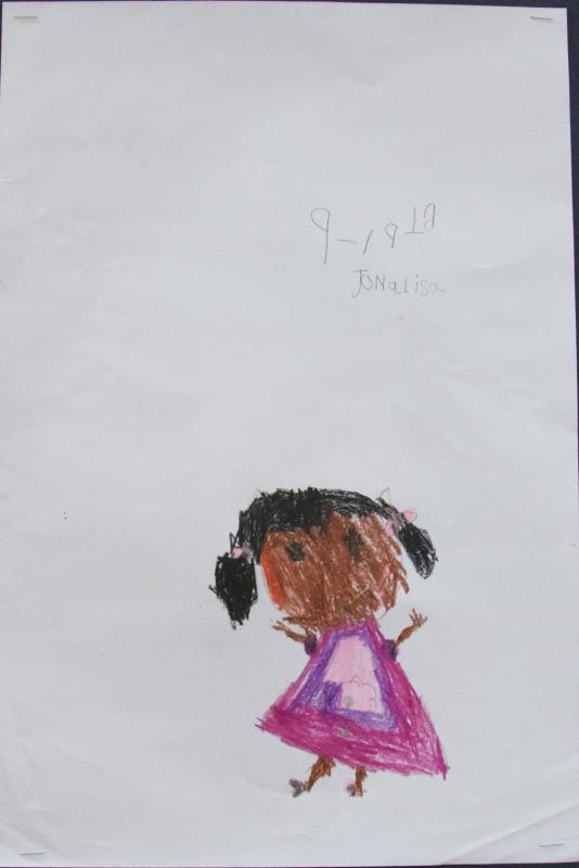 First grader Jonalisa Vieria displayed this self portrait. "It's a picture of me!" she wrote in her artist statement. BY GEORGIA SPARLING